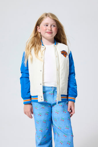 Unisex New York Knicks Youth Bomber Jacket in Sugar Swizzle and Blue